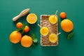 Freshly squeezed orange juice in a glass pitcher and fresh fruits with leaves, healthy drink, vitamin c concept, top view Royalty Free Stock Photo