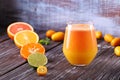 Freshly squeezed orange juice from red and yellow oranges, in one glass, a tasty and healthy drink Royalty Free Stock Photo