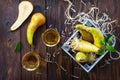 Freshly squeezed pear juice and ripe pear on a wooden table. Top view. The concept of nutrition for superfoods and health or