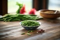 freshly steamed green beans on a rustic wooden table