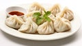 Freshly steamed momos with dip