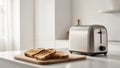 Freshly toasted bread slices beside a modern toaster in a kitchen. Royalty Free Stock Photo
