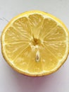 Sliced lemon and lime, comparison, on a white surface, isolated.freshly torn yellow half of lemon on a table in the kitchen