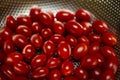 Freshly washed cherry tomatoes in a silver container Royalty Free Stock Photo