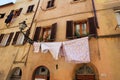 Freshly washed clothes in front of a house