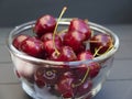 Freshly washed delicious red organic cherries in a glass bowl on a dark table Royalty Free Stock Photo