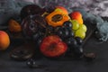 Freshly washed fruits with water droplets. bright high key look conveys freshness. Variety of fresh grapes, apricot and plumes on