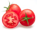 Freshly washed red tomatoes covered with water drops on white background