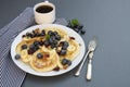 Freshmade, homemade pancakes with blueberry, dried fruits and honey. Breakfast with coffee and pancakes. Deliciious healthy food