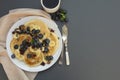 Freshmade, homemade pancakes with blueberry, dried fruits and honey. Breakfast with coffee and pancakes. Deliciious healthy food