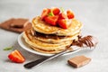 Freshmade pancakes served with strawberry and choco paste