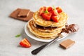 Freshmade pancakes served with strawberry and choco paste