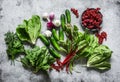 Freshness garden products - seasonal herbs, vegetables and berries on a grey background, top view. Copy space, flat lay