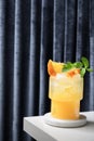 Freshness Mai Tai Classic cocktail or lemonade with lime, orange juice, ice cube and mint on curtain background. Royalty Free Stock Photo