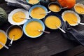 Freshness pumpkin creamy soup for autumn dinner on rustic table. Dinner recipe for family