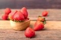 Freshness ripe strawberries are in a wooden bowl