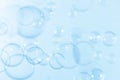 Freshness of Transparent Soap Suds, Bubbles Float on Blue background. Royalty Free Stock Photo