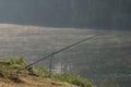 Freshwater angling with rods beside a lake mist morning Royalty Free Stock Photo