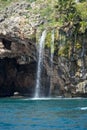 Freshwater waterfall falling on the shores of the Mediterranean between Royalty Free Stock Photo