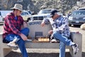 Two men playing Chess outside on a bench in Morro Bay Ca. March 2021