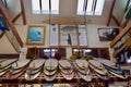 Photo of many surfboards above the rafter in the WaveLength store