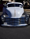 Closeup of a classic 1952 Chevy Truck 3100 gray two-toned exterior paint at a car show