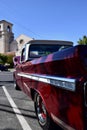 Closeup of a Wine Colored 1965 Classic C-10 Chevy Pickup Truck and white top with hood up Royalty Free Stock Photo