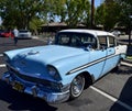 View of a Classic Blue and White Top Chevy Bel Air Car with Original Large Bird Hood in Fresno, USA