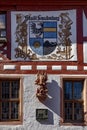 Coat of arms of Stadt Freudenberg - engl: town Freudenberg - with statue of angel as symbol of the town of Freudenberg, Germany