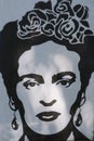 Frida Kahlo graffiti - portrait in black and white with flowers in hair and ear rings painted on wall in Buenos Aires, Argentina Royalty Free Stock Photo