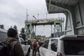 Friday Harbor, WA USA - circa November 2021: View of people and cars exiting the Washington State Ferry as it arrives at Friday