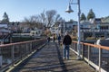 Friday Harbor, WA USA - circa November 2021: View of people walking along the boat docks at Friday Harbor on a beautiful, sunny Royalty Free Stock Photo