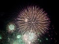 Friday Night Waikiki Fireworks with white and green color burst in the air