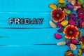 Friday word on blue wood with flower Royalty Free Stock Photo