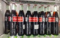 Fridge filled with coca cola bottles. Soft drink 500 ml