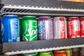 A fridge full of soda cans