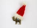 Fridge magnet in shape of camel in Santa Claus hat isolated on white background Royalty Free Stock Photo