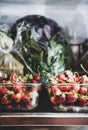 Fridge shelves loaded with fresh summer strawberries in glass containers Royalty Free Stock Photo
