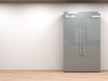 Fridge with side by side doors in empty room Royalty Free Stock Photo