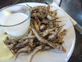 Fried anchovy with garlic sauce Royalty Free Stock Photo