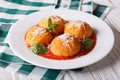 Fried arancini rice balls with tomato sauce on the table. horizo