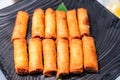 Fried Asian spring rolls with shrimps, vegetables, fruit...on buffet table