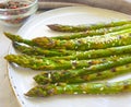 fried asparagus, sesame eating seeds delicious on concrete background