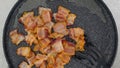 Fried bacon close-up on a frying pan, flat lay Royalty Free Stock Photo