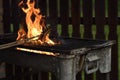 Fried bacon cooked on an open fire