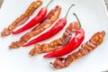 Fried bacon strips with chili pepper Royalty Free Stock Photo
