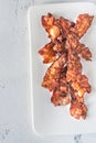 Fried bacon strips on the white plate Royalty Free Stock Photo