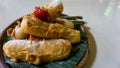 Fried banana with sugar powder and strawberry on top. sweet appetizer in sundanese restaurant