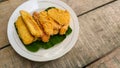 Fried bananas on a leaf on a plate for an afternoon snack