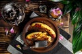 Fried bananas on a wooden platter